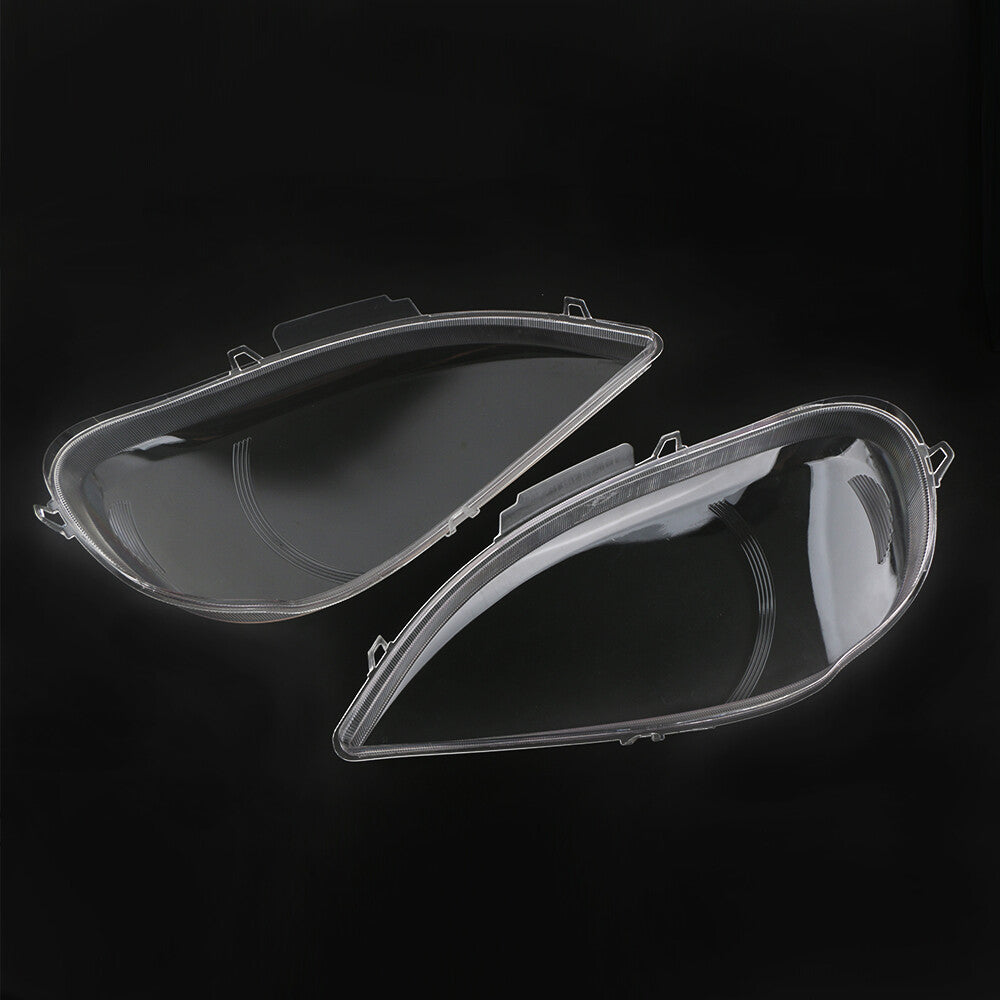 A pair of headlight lens covers for Mercedes-Benz W163 ML-Class 2002-2005.