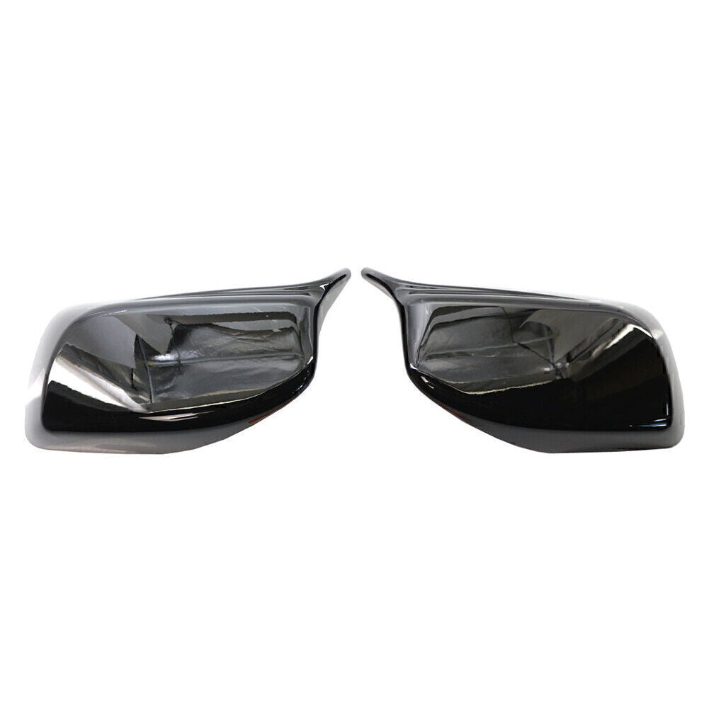 A pair of rearview mirror cover trims for BMW E60/E61 2004-2007 models, no removal tools required.