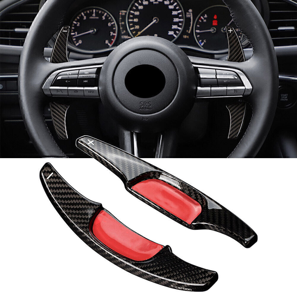 Extended carbon fiber steering wheel paddle shifters suitable for Mazda 3 2020 and 2021 models.