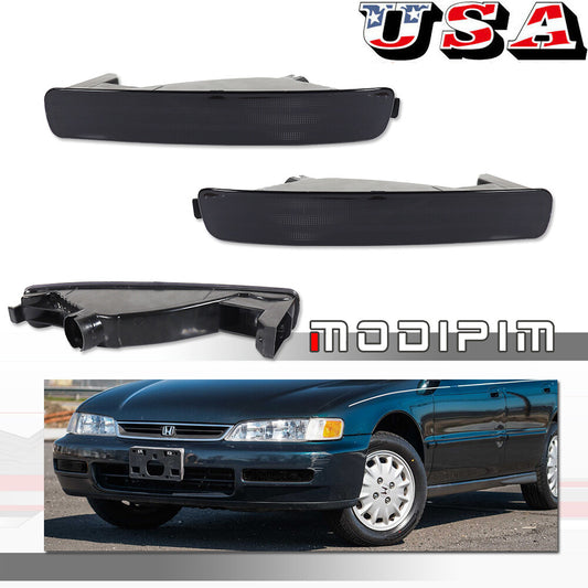 A pair of smoked lens signal bumper light housings for 1996-1997 for Honda Accord.